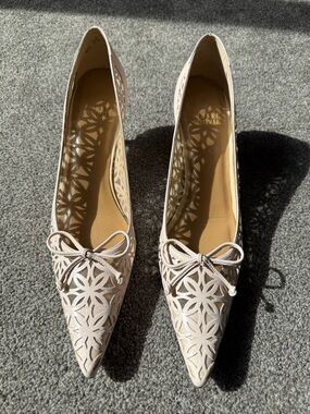 Stuart Weitzman Ivory Laser-Cut Pointed Toe Heels with Bow